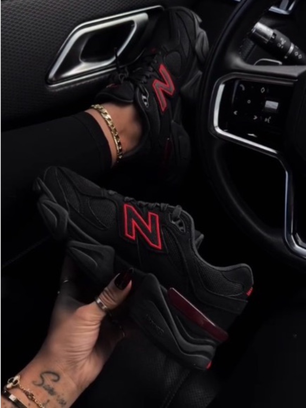 New Balance Black Sneakers with Red Detailing
